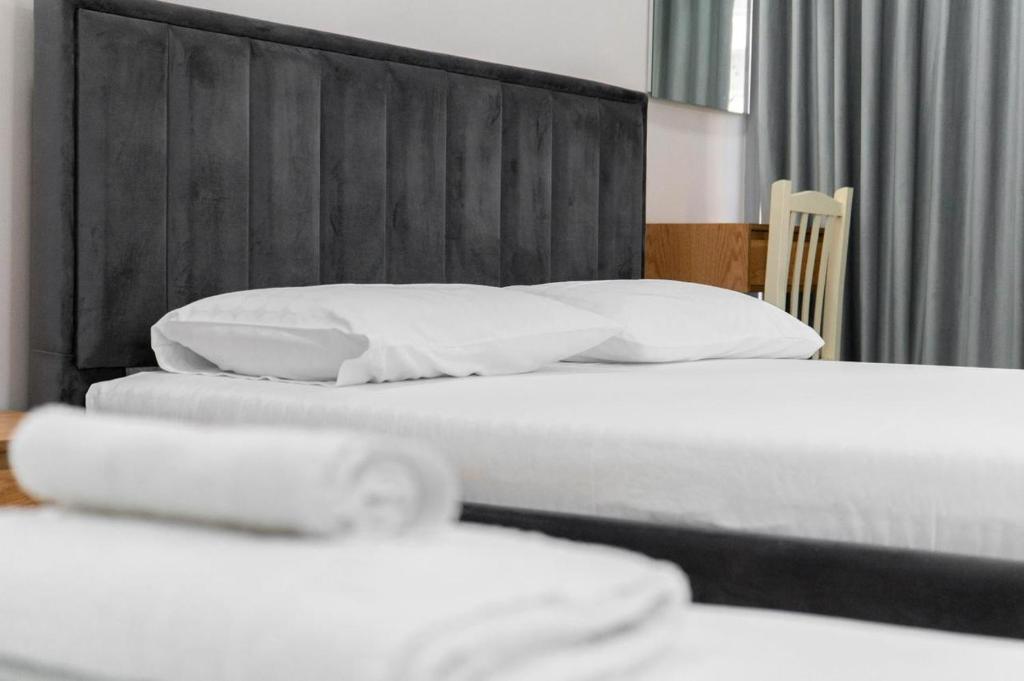 Postel nebo postele na pokoji v ubytování Berti hotel