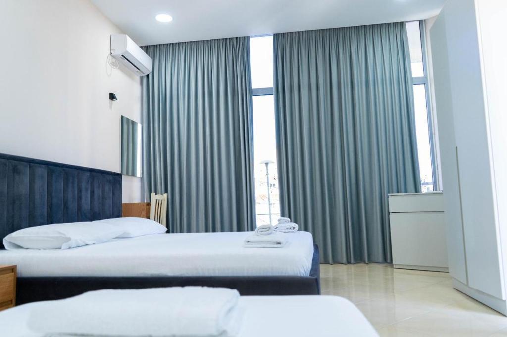 Postel nebo postele na pokoji v ubytování Berti hotel