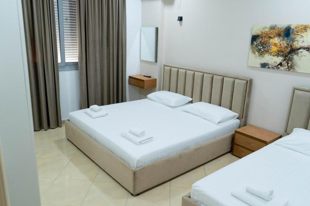 Postel nebo postele na pokoji v ubytování Berti hotel