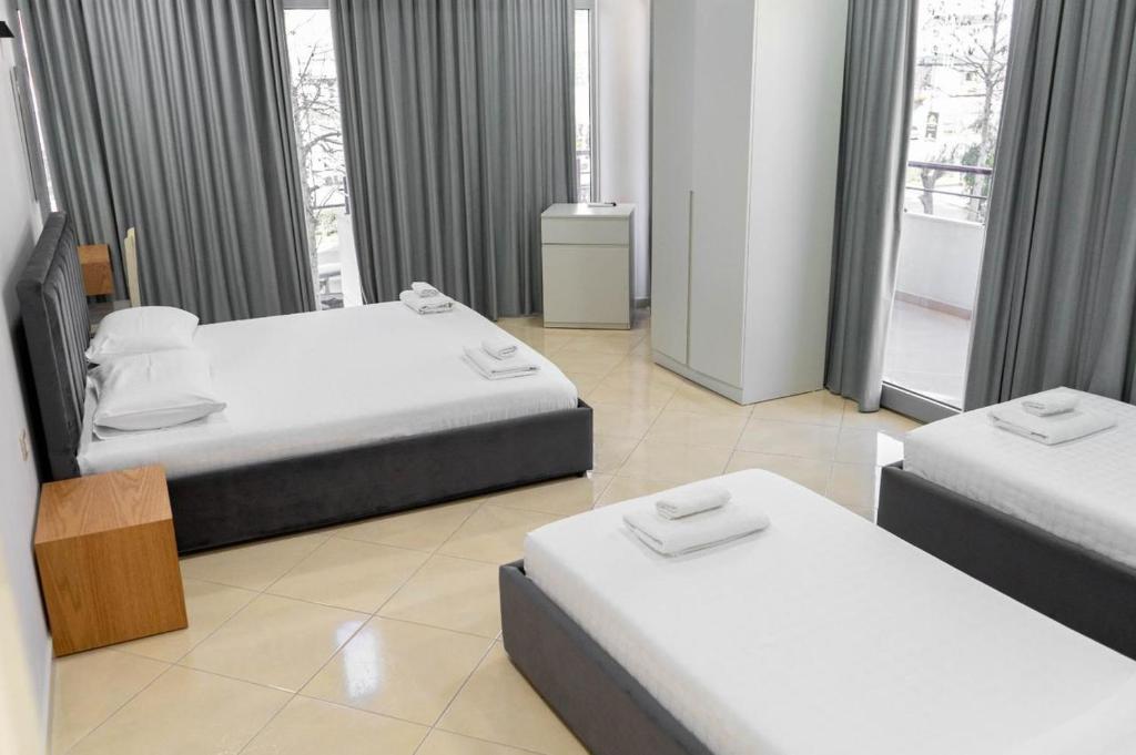 Postel nebo postele na pokoji v ubytování Berti hotel