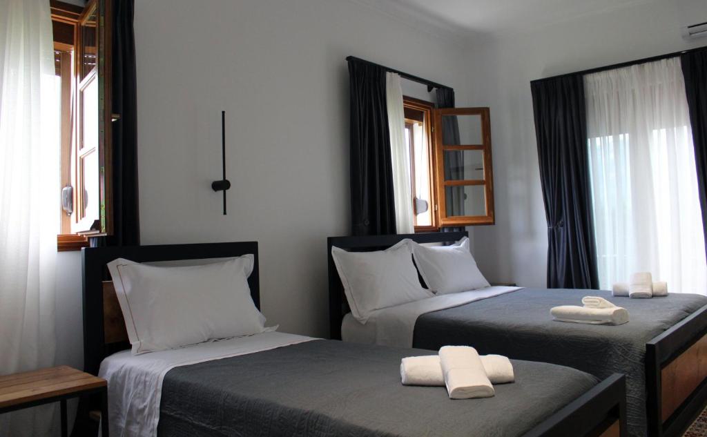 Postel nebo postele na pokoji v ubytování Guest House AmaDes