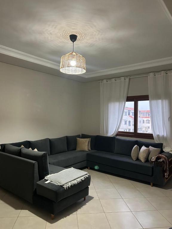 Posezení v ubytování Superbe appartement neuf en résidence avec piscine