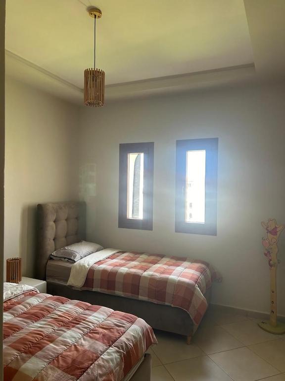Postel nebo postele na pokoji v ubytování Superbe appartement neuf en résidence avec piscine