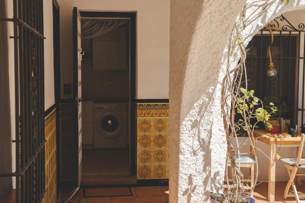 an entrance to a house with a washing machine at Casa con encanto in Corbera de Llobregat