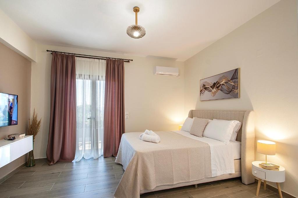 En eller flere senge i et værelse på Ben's Apartments - DELUXE STUDIO