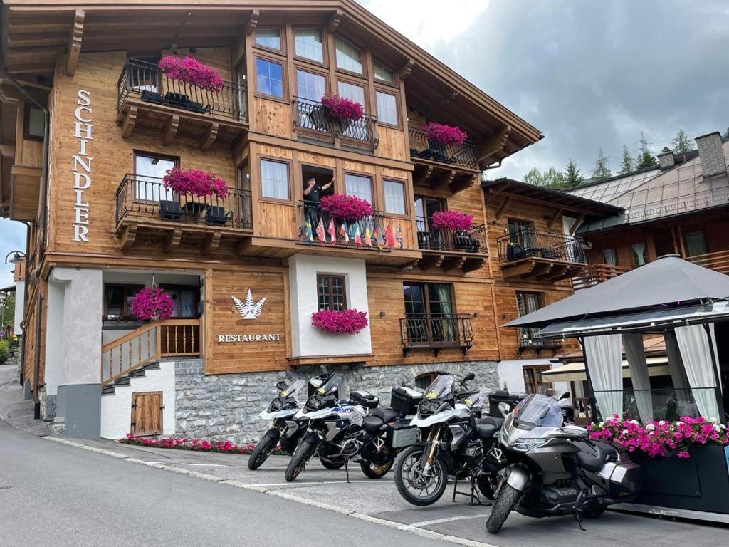 a group of motorcycles parked in front of a building at Schindler in Sankt Anton am Arlberg