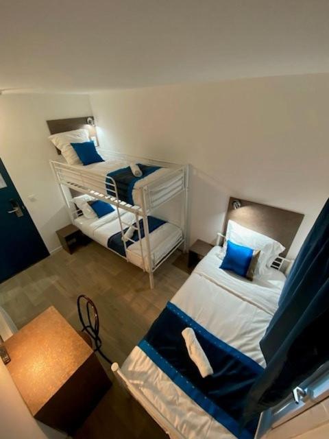 Postel nebo postele na pokoji v ubytování Fasthotel - Soissons Nord