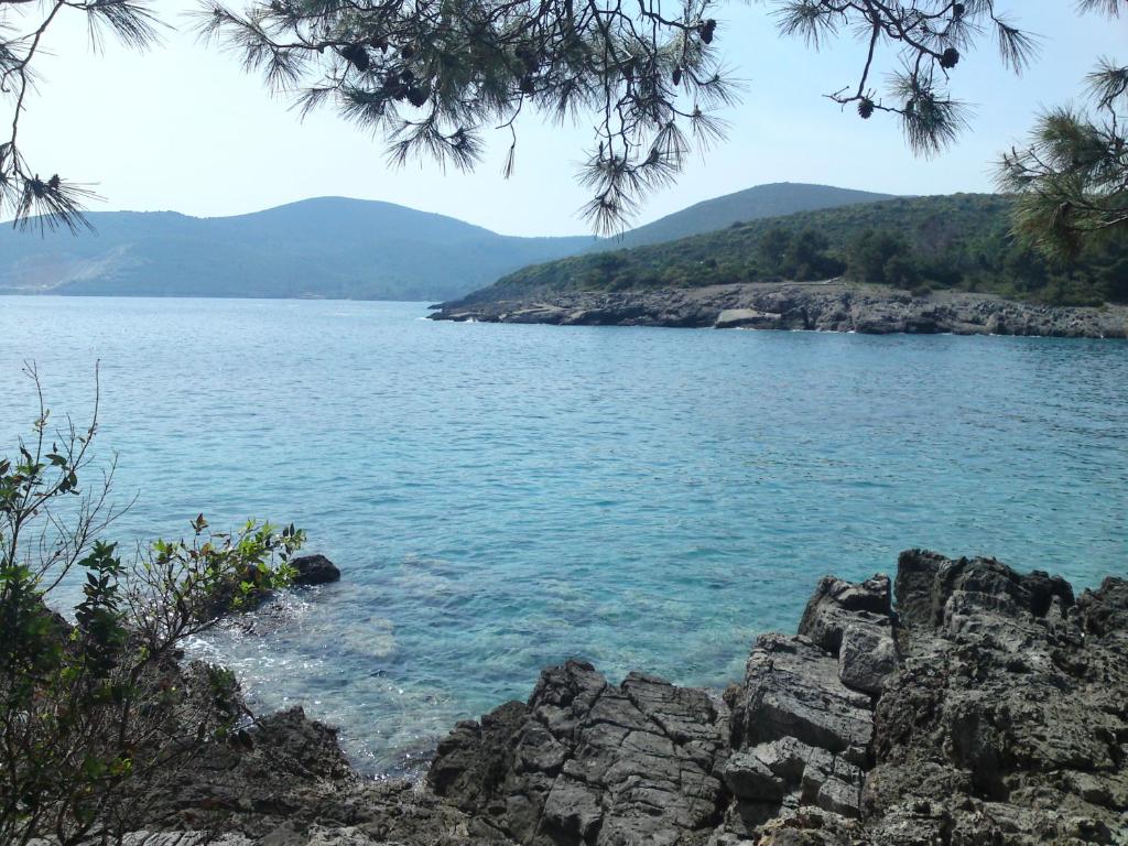 a view of a lake with mountains in the background at Vip apartmani in Tivat