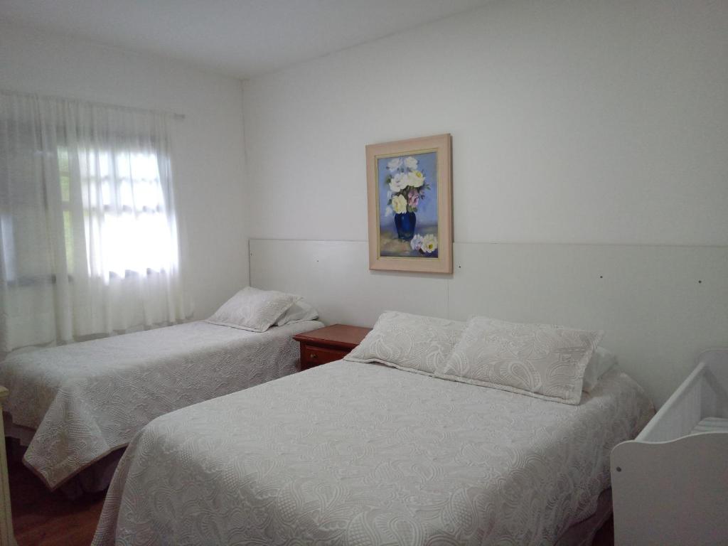Postel nebo postele na pokoji v ubytování Casa dos Neves