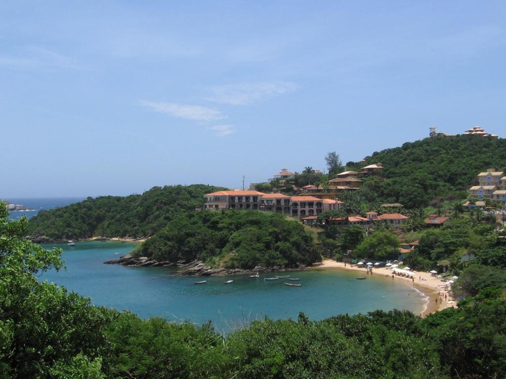 a view of a beach with boats in the water at BUZIOS PRAIA PISCINA ePOR doSOL noMar in Búzios
