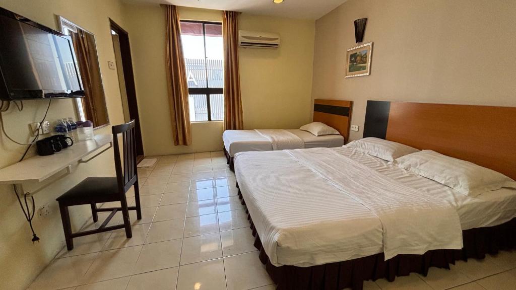 Postel nebo postele na pokoji v ubytování Hotel Centum
