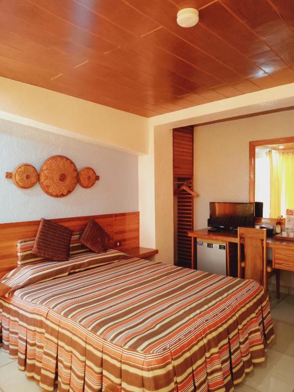 Postel nebo postele na pokoji v ubytování CITI HOTEL