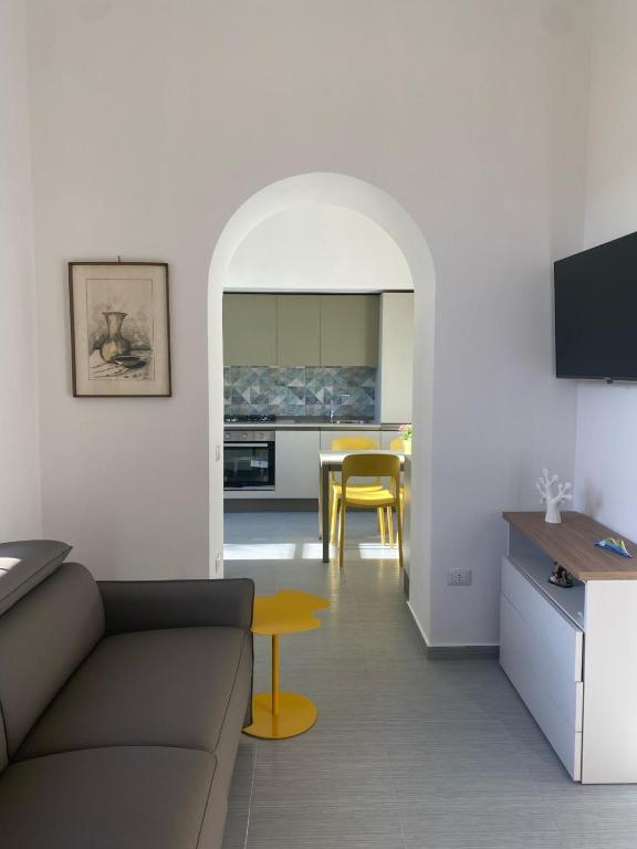 a living room with a couch and a table at Daddy House in San Giorgio a Cremano