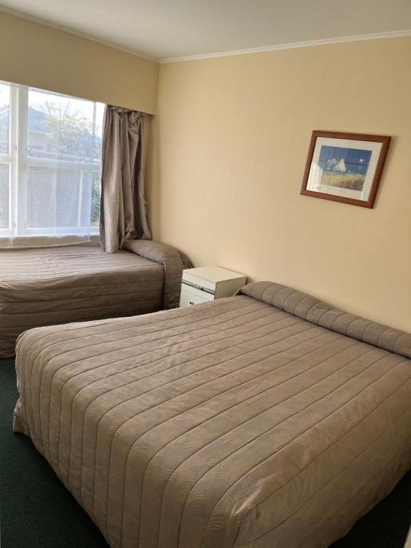 Postel nebo postele na pokoji v ubytování Classic Motel