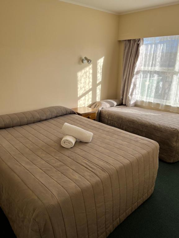 Postel nebo postele na pokoji v ubytování Classic Motel