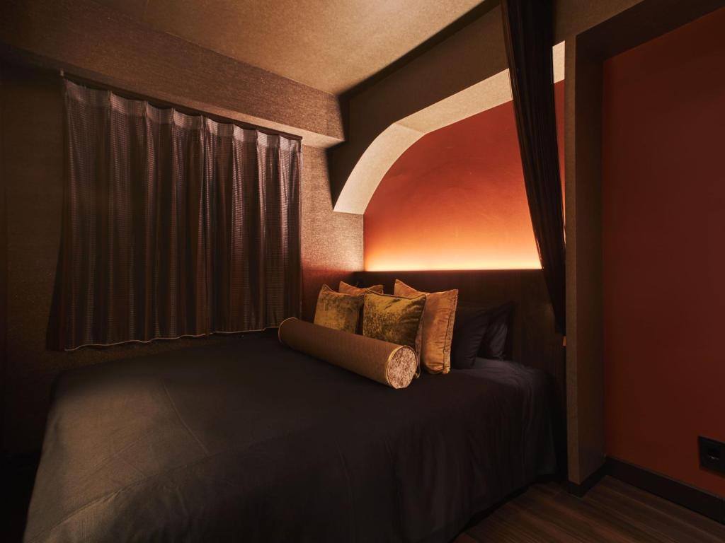 Postel nebo postele na pokoji v ubytování Roppongi Hotel S