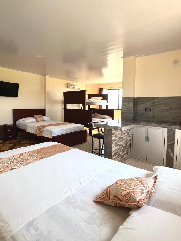 Postel nebo postele na pokoji v ubytování HOTEL SUEÑOS BEACH