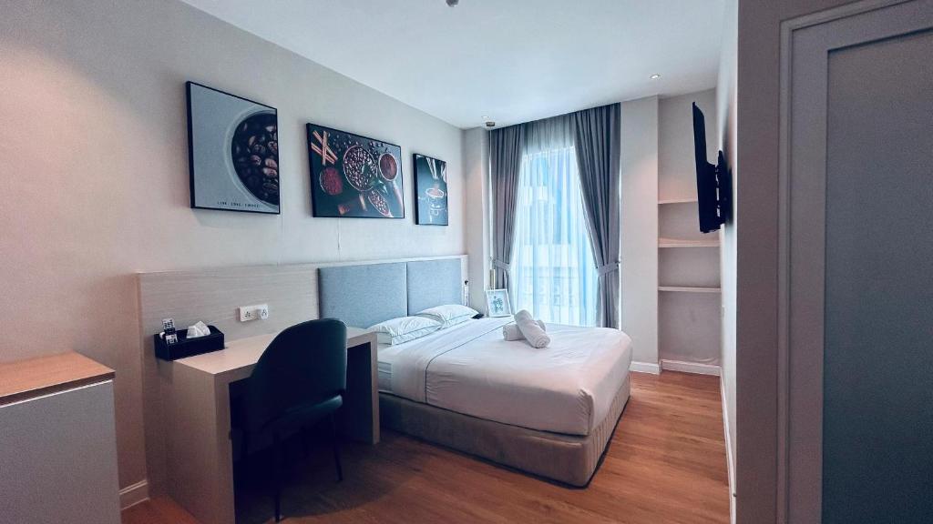 Postel nebo postele na pokoji v ubytování AP Concept Hotel