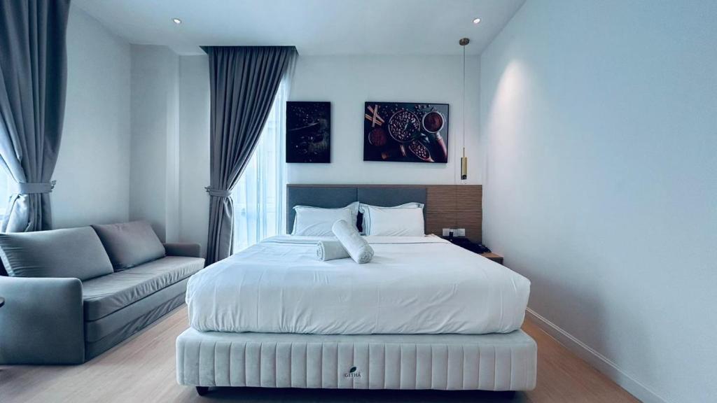 Postel nebo postele na pokoji v ubytování AP Concept Hotel