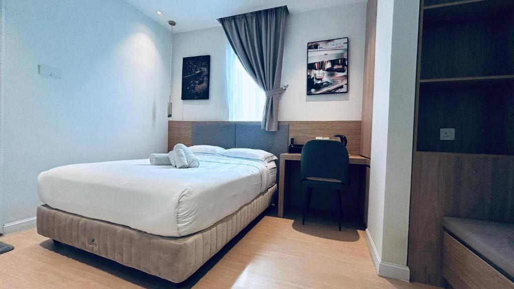 Postel nebo postele na pokoji v ubytování AP Concept Hotel