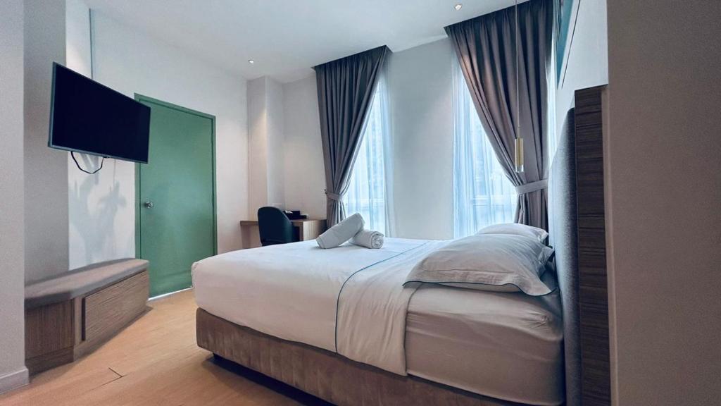 Postel nebo postele na pokoji v ubytování AP Concept Hotel