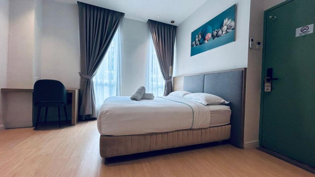 Postel nebo postele na pokoji v ubytování AP Concept Hotel