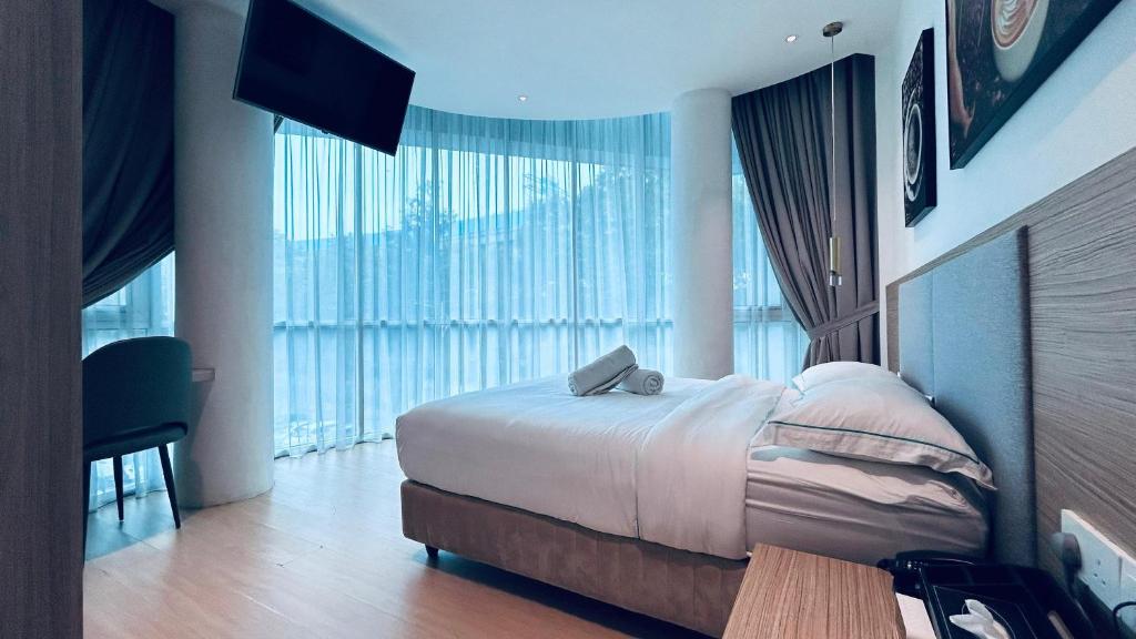 Postel nebo postele na pokoji v ubytování AP Concept Hotel