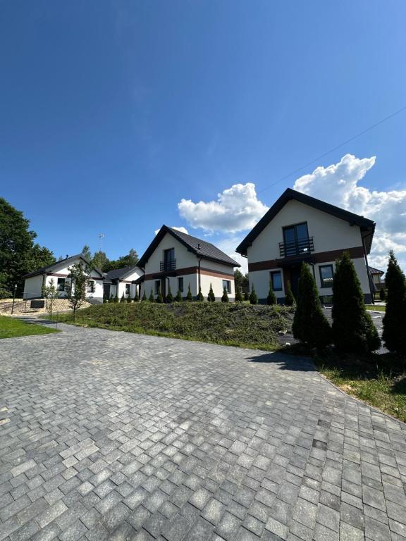 a house on a hill with a driveway at Nova 26 in Klucze