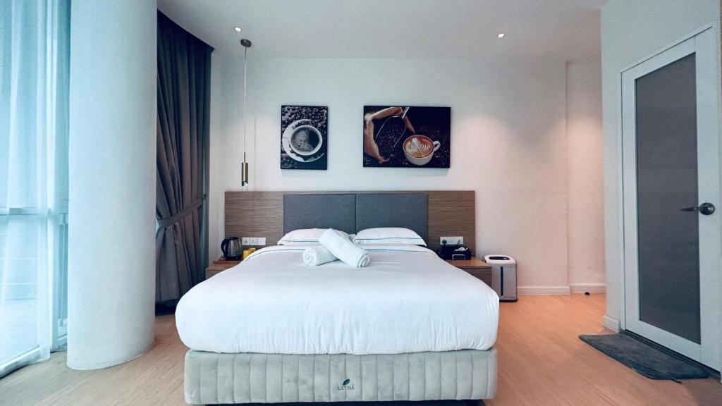 Postel nebo postele na pokoji v ubytování AP Concept Hotel