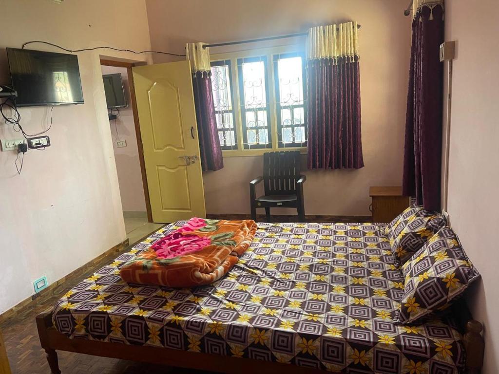 Postel nebo postele na pokoji v ubytování Hotel PNR'S Paradise