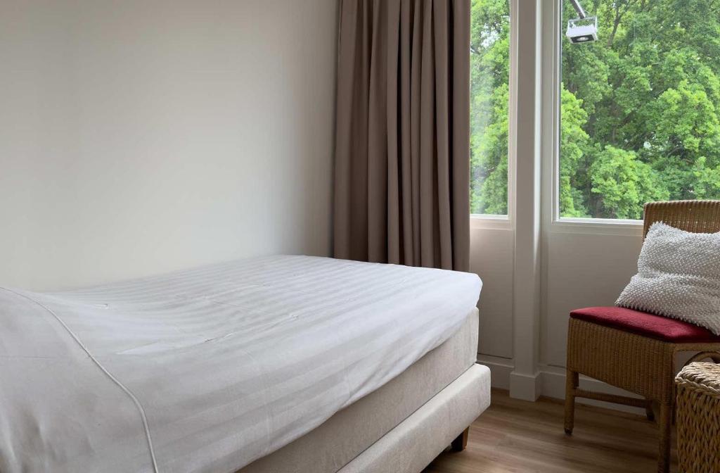 Postel nebo postele na pokoji v ubytování Hotel 't Spijker