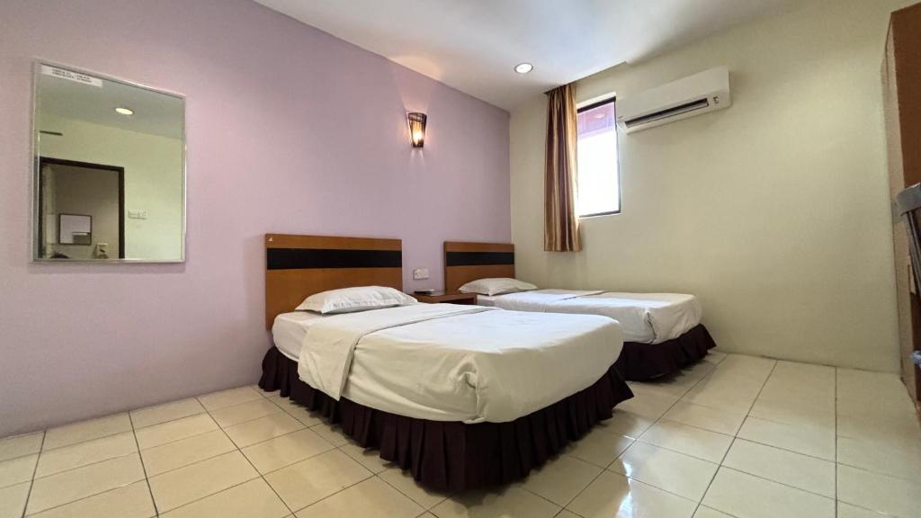 Postel nebo postele na pokoji v ubytování Hotel Centum