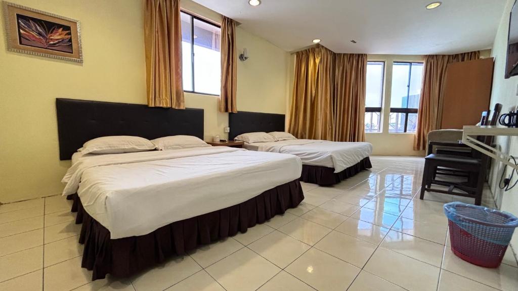 Postel nebo postele na pokoji v ubytování Hotel Centum
