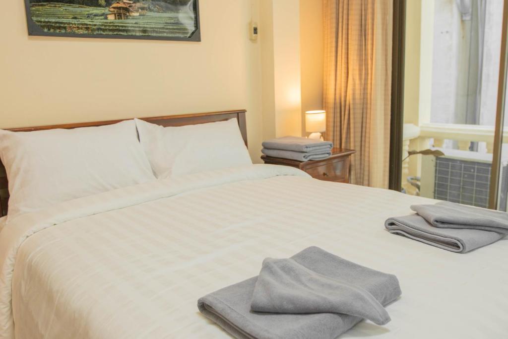 Postel nebo postele na pokoji v ubytování Maiiam Guesthouse Patong