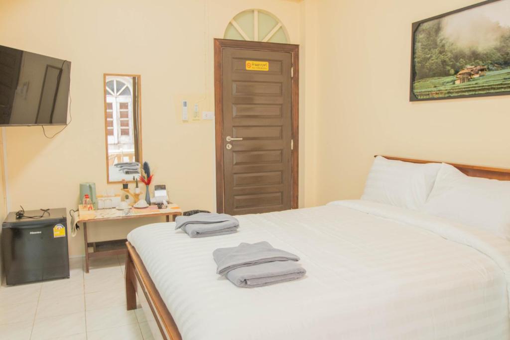 Postel nebo postele na pokoji v ubytování Maiiam Guesthouse Patong