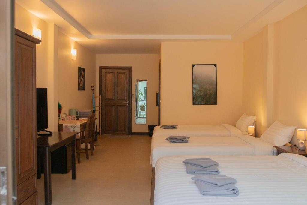 Postel nebo postele na pokoji v ubytování Maiiam Guesthouse Patong