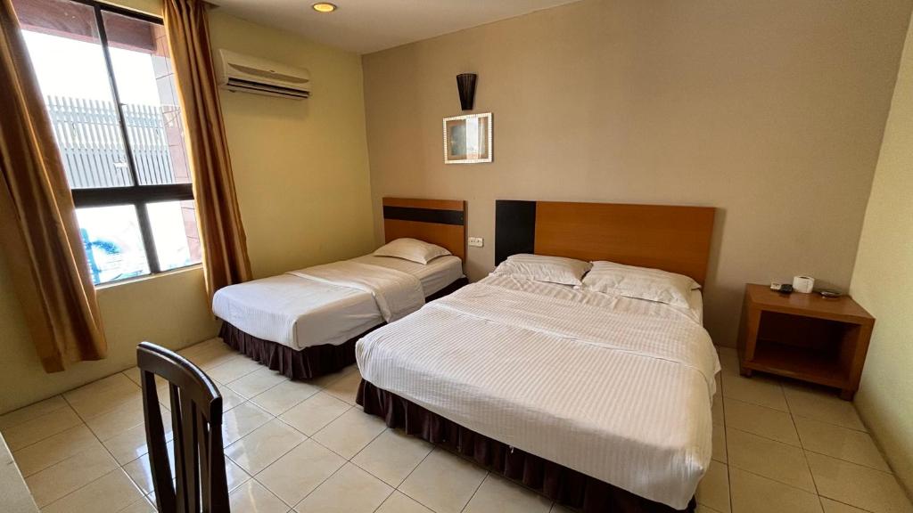 Postel nebo postele na pokoji v ubytování Hotel Centum