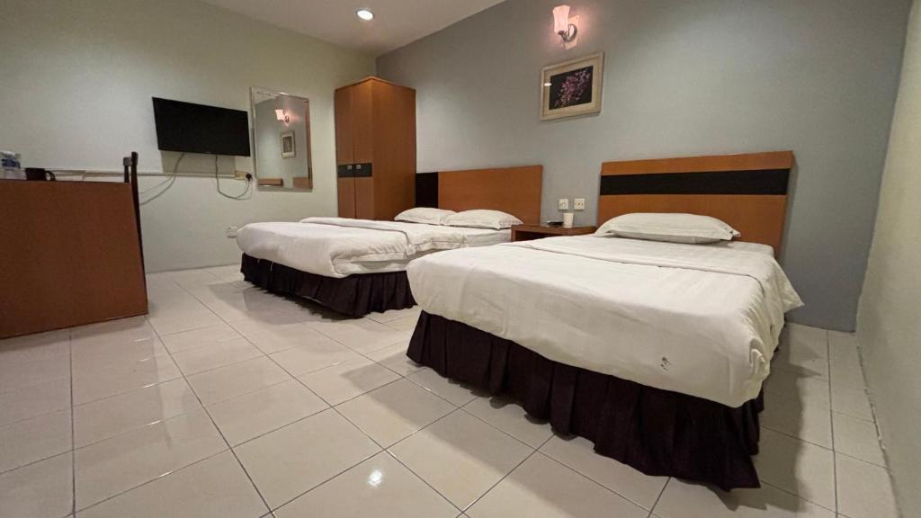 Postel nebo postele na pokoji v ubytování Hotel Centum