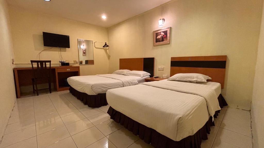 Postel nebo postele na pokoji v ubytování Hotel Centum