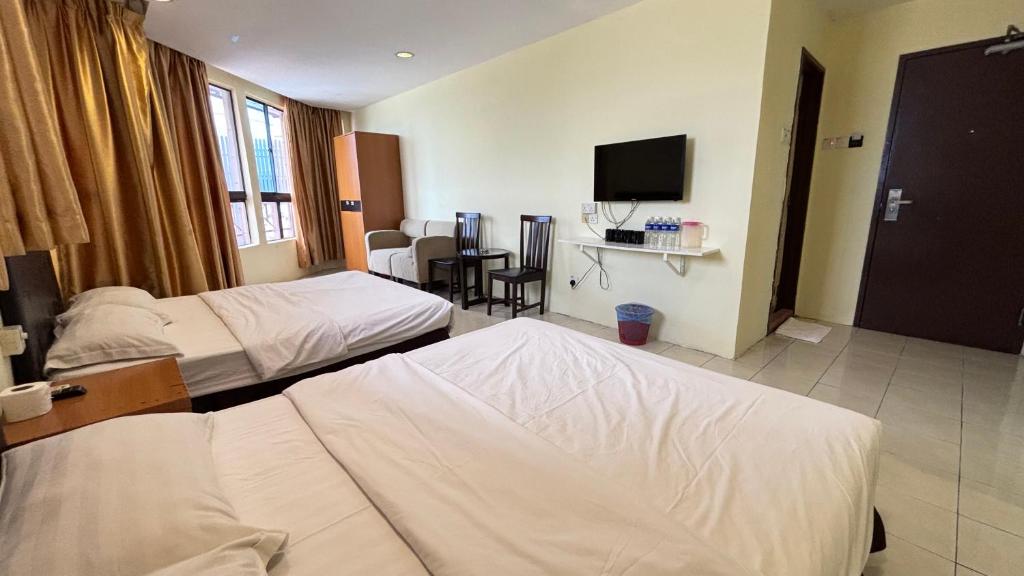 Postel nebo postele na pokoji v ubytování Hotel Centum