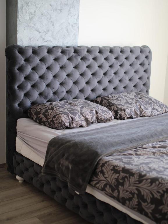 Postel nebo postele na pokoji v ubytování Apartman Gray 82