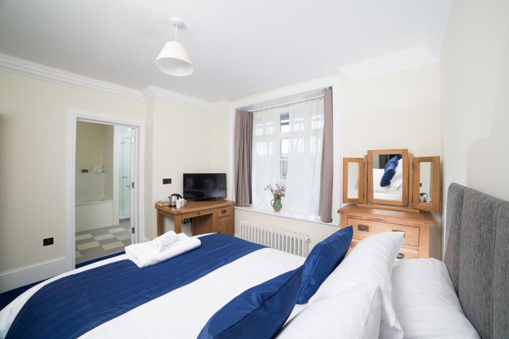 Postel nebo postele na pokoji v ubytování Northgate House