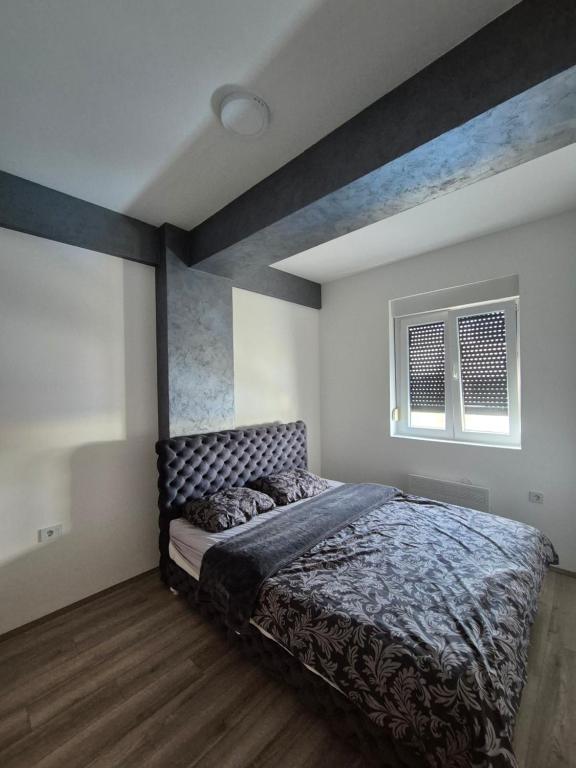 Postel nebo postele na pokoji v ubytování Apartman Gray 82