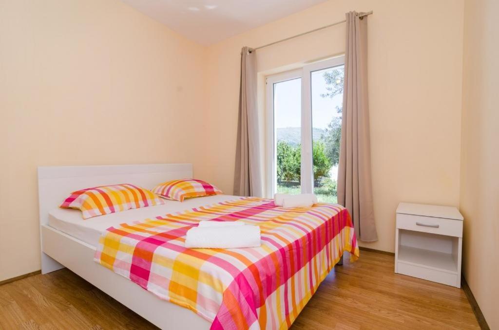 Posteľ alebo postele v izbe v ubytovaní Apartments & Rooms Tapera