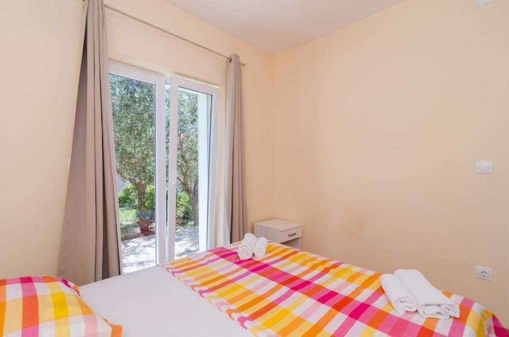 Posteľ alebo postele v izbe v ubytovaní Apartments & Rooms Tapera