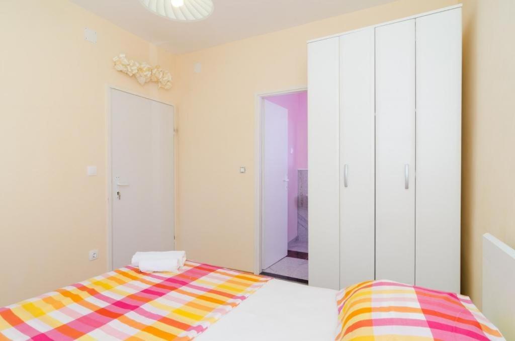 Posteľ alebo postele v izbe v ubytovaní Apartments & Rooms Tapera