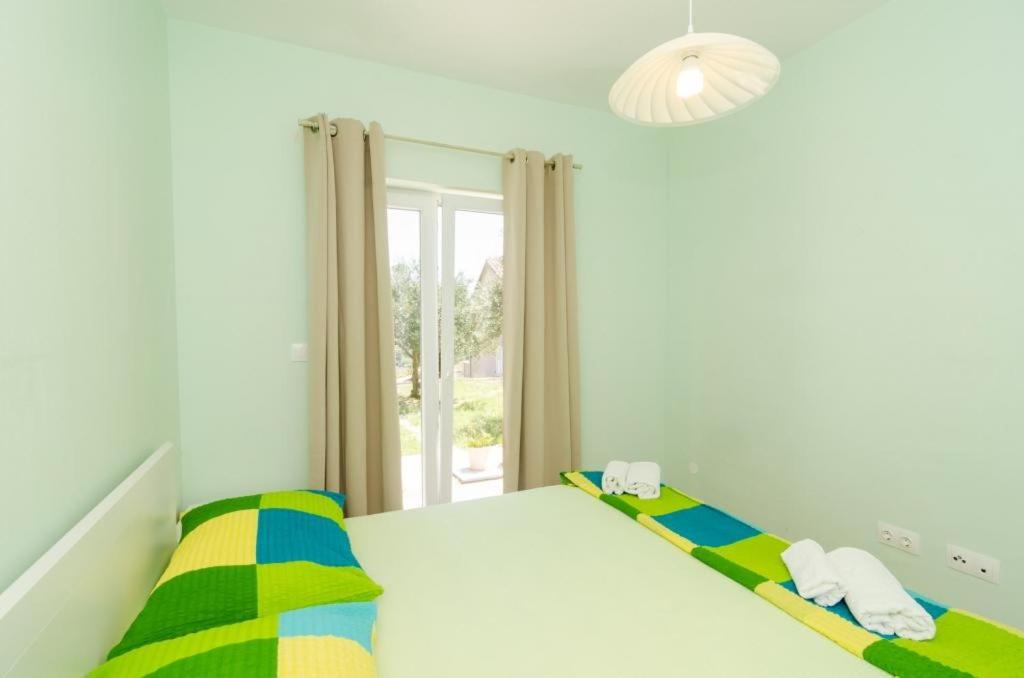Posteľ alebo postele v izbe v ubytovaní Apartments & Rooms Tapera