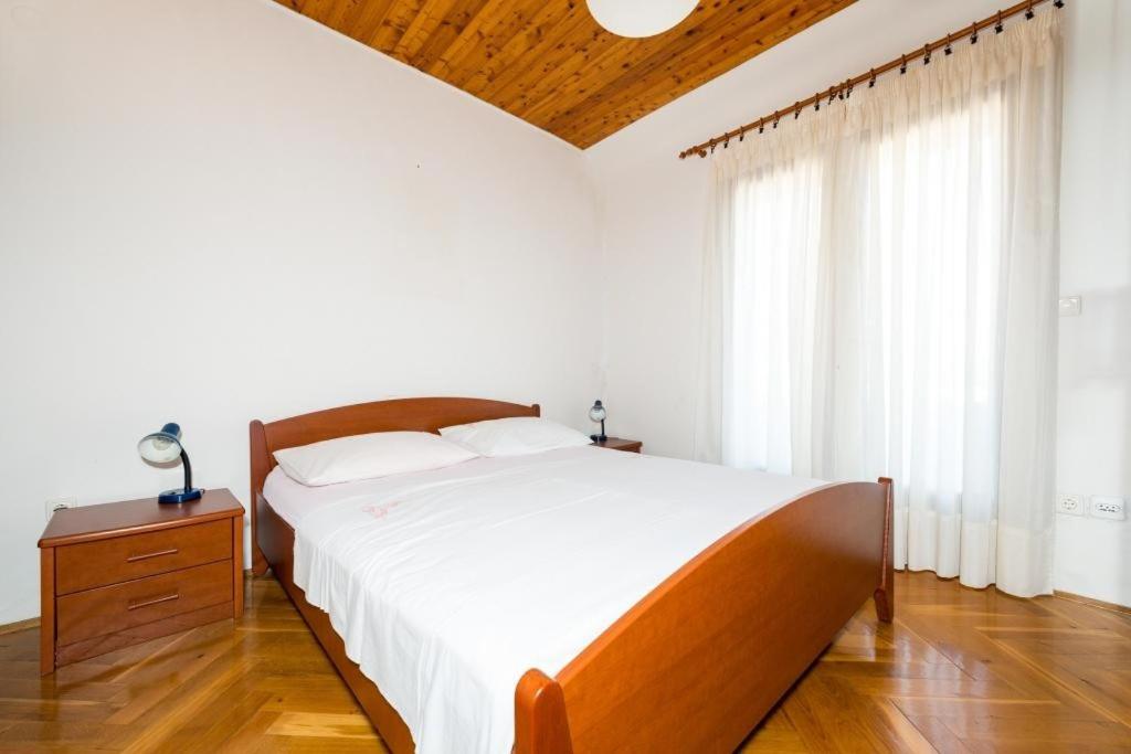 Posteľ alebo postele v izbe v ubytovaní Apartments & Rooms Tapera