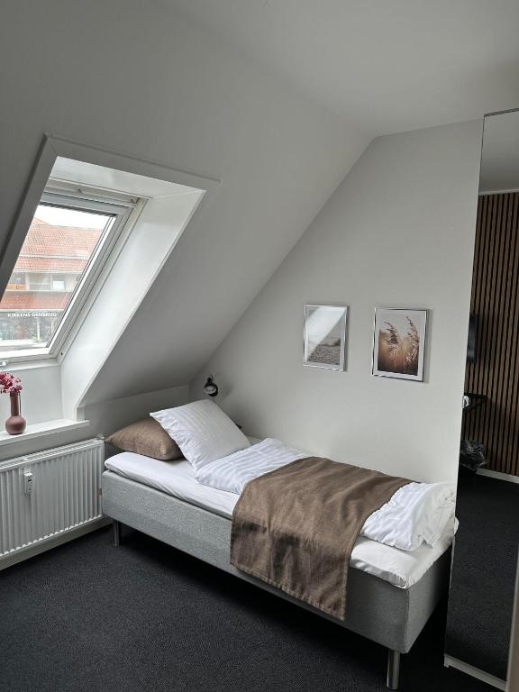 Postel nebo postele na pokoji v ubytování VISIONHOUSE Hotel