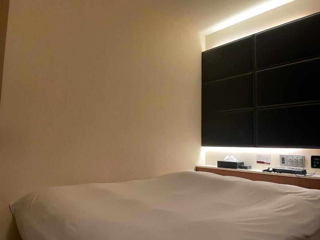 Postel nebo postele na pokoji v ubytování Hotel BIX チェックイン23時 変更不可